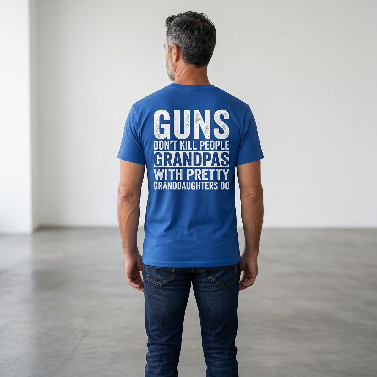  blue heavy cotton t-shirt with white distressed text print on back worn by a man in jeans