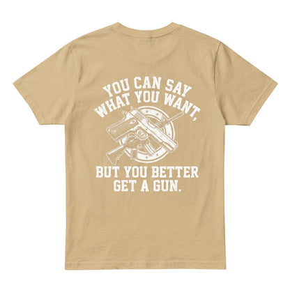  tan cotton t-shirt featuring a white graphic print of a gun and the text You can say what you want