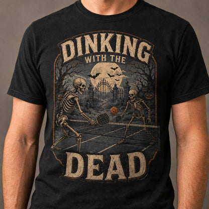  black cotton t-shirt featuring a vintage skeleton pickleball graphic with a spooky Halloween theme.